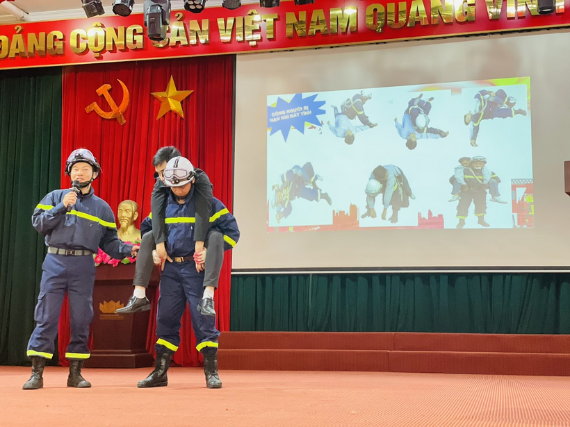 A picture containing text, person, building, standingDescription automatically generated