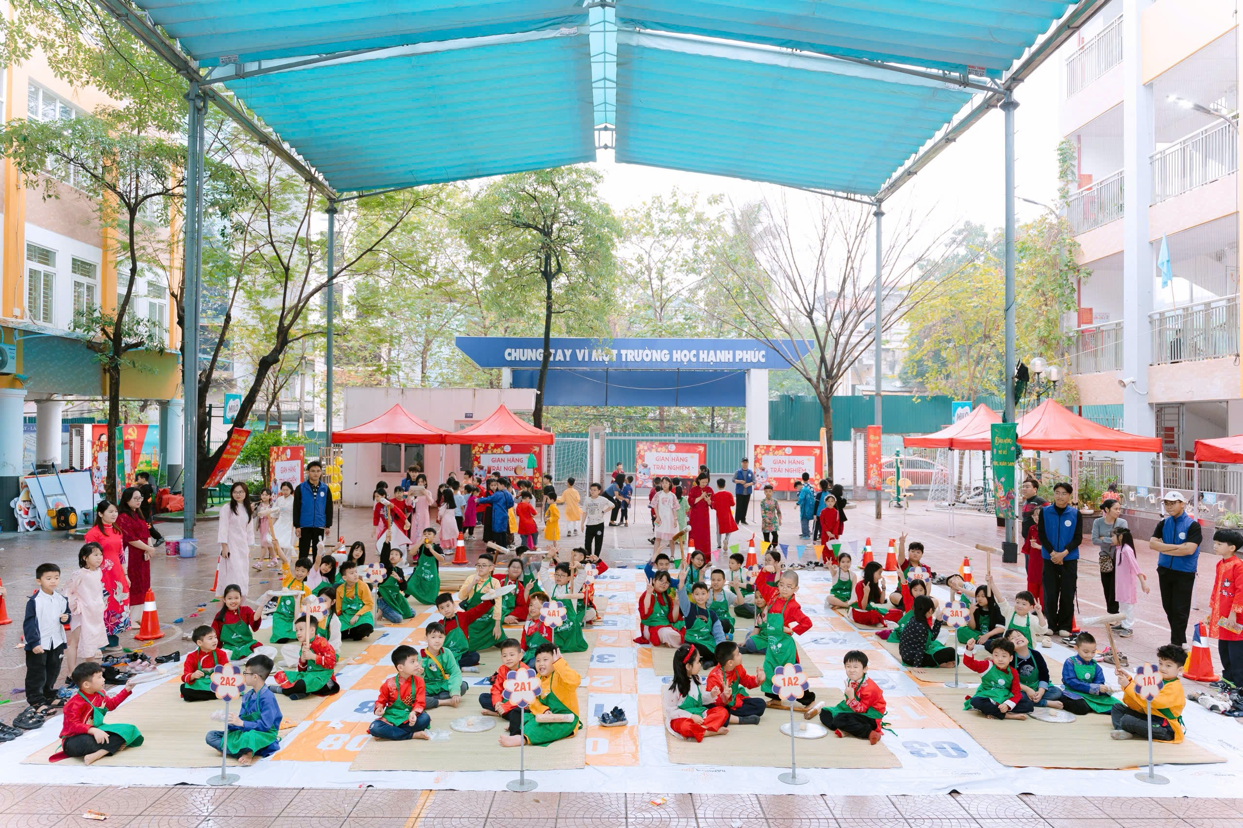 A group of children sitting on the ground
Description automatically generated