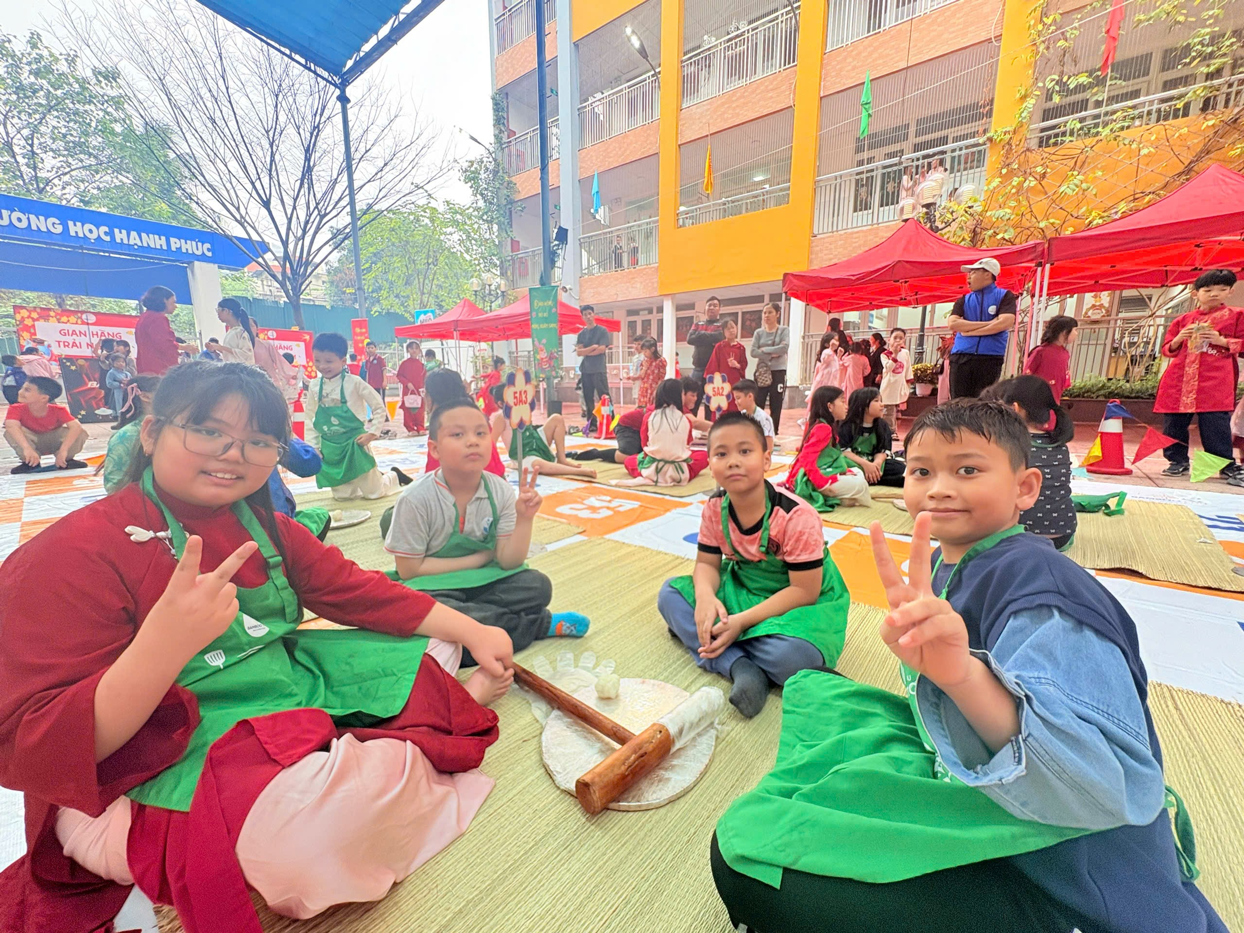 A group of children sitting on the ground
Description automatically generated