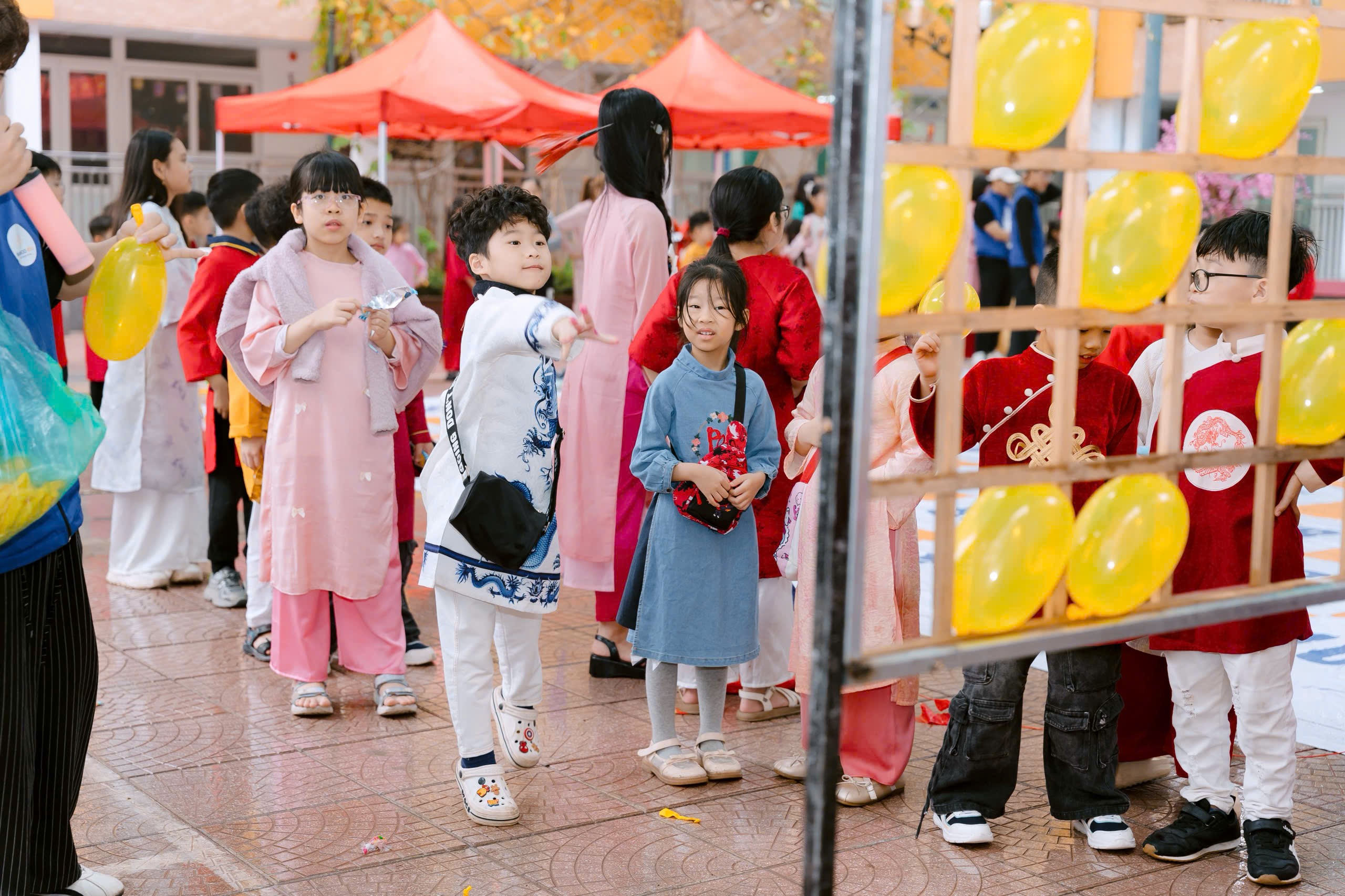 A group of children standing in a line
Description automatically generated