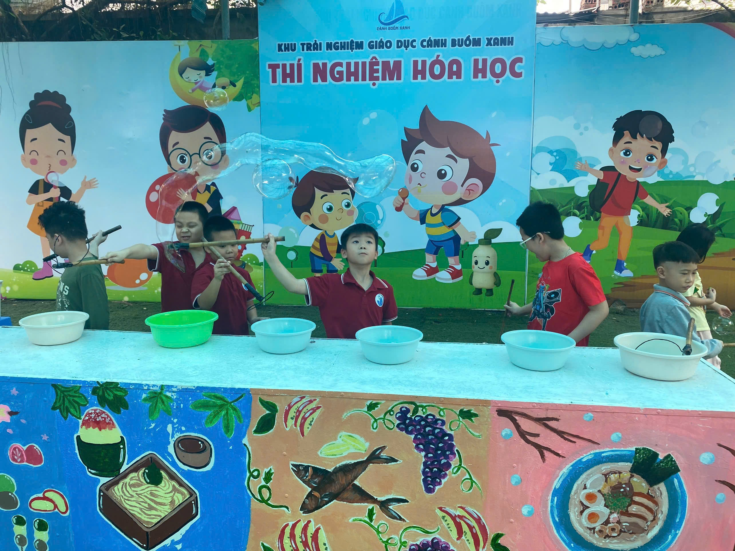 A group of kids playing with water

Description automatically generated